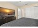 Comfortable bedroom with TV, closet, and warm lighting at 1800 Johnson Dr, Clermont, FL 34711