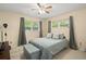 Bright bedroom with large windows, ceiling fan and comfortable bed at 1800 Johnson Dr, Clermont, FL 34711