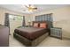 Comfortable bedroom with ample natural light and ceiling fan at 1800 Johnson Dr, Clermont, FL 34711