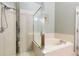 Bathroom features a separate shower and tub, along with neutral tile at 2109 Carpathian Dr, Apopka, FL 32712