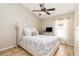 Bright bedroom with ceiling fan, comfortable bed, and natural light at 2109 Carpathian Dr, Apopka, FL 32712