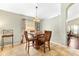 Bright dining area featuring a square wood table with chairs and abundant natural light at 2109 Carpathian Dr, Apopka, FL 32712