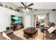 Inviting living room features a ceiling fan, tv, and sliding door leading to the patio at 2109 Carpathian Dr, Apopka, FL 32712