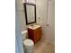 Bathroom featuring a vanity, toilet, mirror, and tiled floors at 2533 Grassy Point Dr # 113, Lake Mary, FL 32746