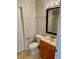 Bathroom with vanity, mirror, and tiled floors at 2533 Grassy Point Dr # 113, Lake Mary, FL 32746