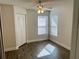 Bright bedroom featuring wood-look floors, a ceiling fan, and a closet at 2533 Grassy Point Dr # 113, Lake Mary, FL 32746