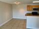 Kitchen and dining area with tile flooring and granite countertops at 2533 Grassy Point Dr # 113, Lake Mary, FL 32746