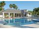 Community pool featuring lounge chairs and palm trees at 2533 Grassy Point Dr # 113, Lake Mary, FL 32746