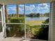 Enjoy the tranquil lake view from the screened-in porch at 2533 Grassy Point Dr # 113, Lake Mary, FL 32746