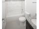 Bathroom featuring tub with decorative tiling, granite countertop, and modern fixtures at 2681 Sw 161St Loop, Ocala, FL 34473