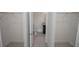 Hallway view showing the entrance to a bathroom, located between two spacious closets with shelving at 2681 Sw 161St Loop, Ocala, FL 34473