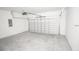 Spacious garage with concrete floor and white walls, ready for parking and storage at 2681 Sw 161St Loop, Ocala, FL 34473