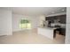 Bright, open layout kitchen and living room area with tile floors and stainless steel appliances at 2681 Sw 161St Loop, Ocala, FL 34473