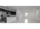 Bright, open layout kitchen and living room area with tile floors and stainless steel appliances at 2681 Sw 161St Loop, Ocala, FL 34473