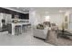 Open-concept living room, kitchen, and dining area with neutral decor and modern accents at 2681 Sw 161St Loop, Ocala, FL 34473