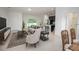 Bright living room with neutral tones open to the kitchen and dining area at 2681 Sw 161St Loop, Ocala, FL 34473