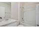 Cozy bathroom featuring a vanity, toilet, and a tub/shower combo with a shower curtain at 2736 Dumont Ln, Tavares, FL 32778