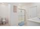 Bathroom featuring a shower, toilet, vanity, and a framed print at 2736 Dumont Ln, Tavares, FL 32778