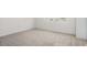 Empty bedroom featuring neutral carpet and a window at 2736 Dumont Ln, Tavares, FL 32778