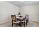 Elegant dining room featuring a wood table, six upholstered chairs, and modern decor at 2736 Dumont Ln, Tavares, FL 32778