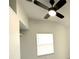 Corner view of a bedroom with ceiling fan and window at 300 S Aurora Dr, Apopka, FL 32703