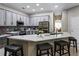 Beautiful kitchen featuring quartz countertops, a stylish backsplash, and stainless steel appliances at 334 Prestwick Dr, Davenport, FL 33897