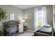 Charming Bedroom featuring a crib, changing table, and natural light at 3905 Diving Dove Ln, Bartow, FL 33830