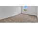 Bedroom featuring neutral carpet, a window with a view, and a double door closet at 520 Pinecrest Loop, Davenport, FL 33837