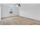 Bedroom featuring neutral carpet and a window that provides natural light and a view at 520 Pinecrest Loop, Davenport, FL 33837