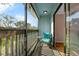 Secluded balcony features a chair and lots of light at 7468 Swallow Run # 38, Winter Park, FL 32792