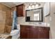 Bathroom featuring a standup shower, dark wood vanity, and mosaic backsplash at 7468 Swallow Run # 38, Winter Park, FL 32792