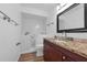 Bathroom featuring a walk-in shower with grab bars, vanity, and commode at 7468 Swallow Run # 38, Winter Park, FL 32792