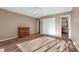 Bedroom featuring a closet, hard flooring, a dresser, and an ensuite bathroom at 7468 Swallow Run # 38, Winter Park, FL 32792