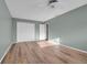 Empty bedroom with hard flooring, closet, and neutral paint at 7468 Swallow Run # 38, Winter Park, FL 32792