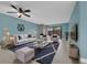 Bright living room featuring tile floors, a ceiling fan, and neutral colored furniture at 7468 Swallow Run # 38, Winter Park, FL 32792