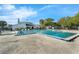 Community pool with large pool deck and plenty of seating at 7468 Swallow Run # 38, Winter Park, FL 32792