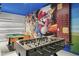 Fun game room featuring a pool table, foosball table, and a vibrant Mario-themed mural on the wall at 7641 Fairfax Dr, Kissimmee, FL 34747