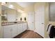 Bathroom featuring a dual sink vanity and wood floors at 846 Asturias Rd, Davenport, FL 33837