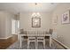 Inviting dining area featuring a decorative chandelier and carpet at 846 Asturias Rd, Davenport, FL 33837