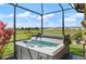 Backyard hot tub with beautiful views of the surrounding neighborhood and nearby pond at 846 Asturias Rd, Davenport, FL 33837