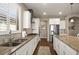 Beautiful kitchen featuring granite countertops, white cabinets, and stainless steel appliances at 846 Asturias Rd, Davenport, FL 33837