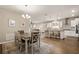 Modern kitchen featuring stainless steel appliances, a breakfast bar, and hardwood floors at 846 Asturias Rd, Davenport, FL 33837