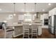 Elegant kitchen with stainless appliances, a center island, and pendant lighting at 846 Asturias Rd, Davenport, FL 33837