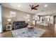 Open-concept living room leading to the kitchen with hardwood floors and comfortable seating at 846 Asturias Rd, Davenport, FL 33837