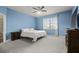 Bright main bedroom features plantation shutters and neutral carpet at 846 Asturias Rd, Davenport, FL 33837