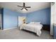 Spacious main bedroom with a ceiling fan and an ensuite bathroom at 846 Asturias Rd, Davenport, FL 33837