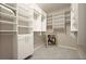 Organized walk-in closet with shelves and drawers for ample storage at 846 Asturias Rd, Davenport, FL 33837