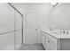 Bright bathroom featuring a glass shower, double vanity, and modern fixtures at 8651 Sw 138Th St # 68, Ocala, FL 34473