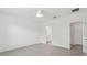 This bedroom offers neutral tones, tile flooring, and a ceiling fan for a relaxing ambiance at 8651 Sw 138Th St # 68, Ocala, FL 34473