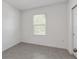 Bedroom featuring tile flooring, a window, and neutral walls at 8651 Sw 138Th St # 68, Ocala, FL 34473